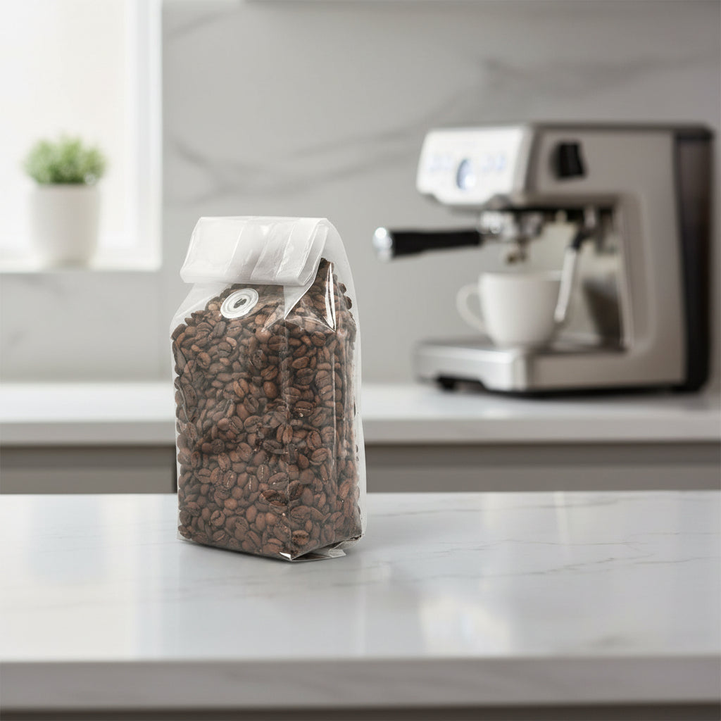 Clear bag filled with coffee beans on a white background