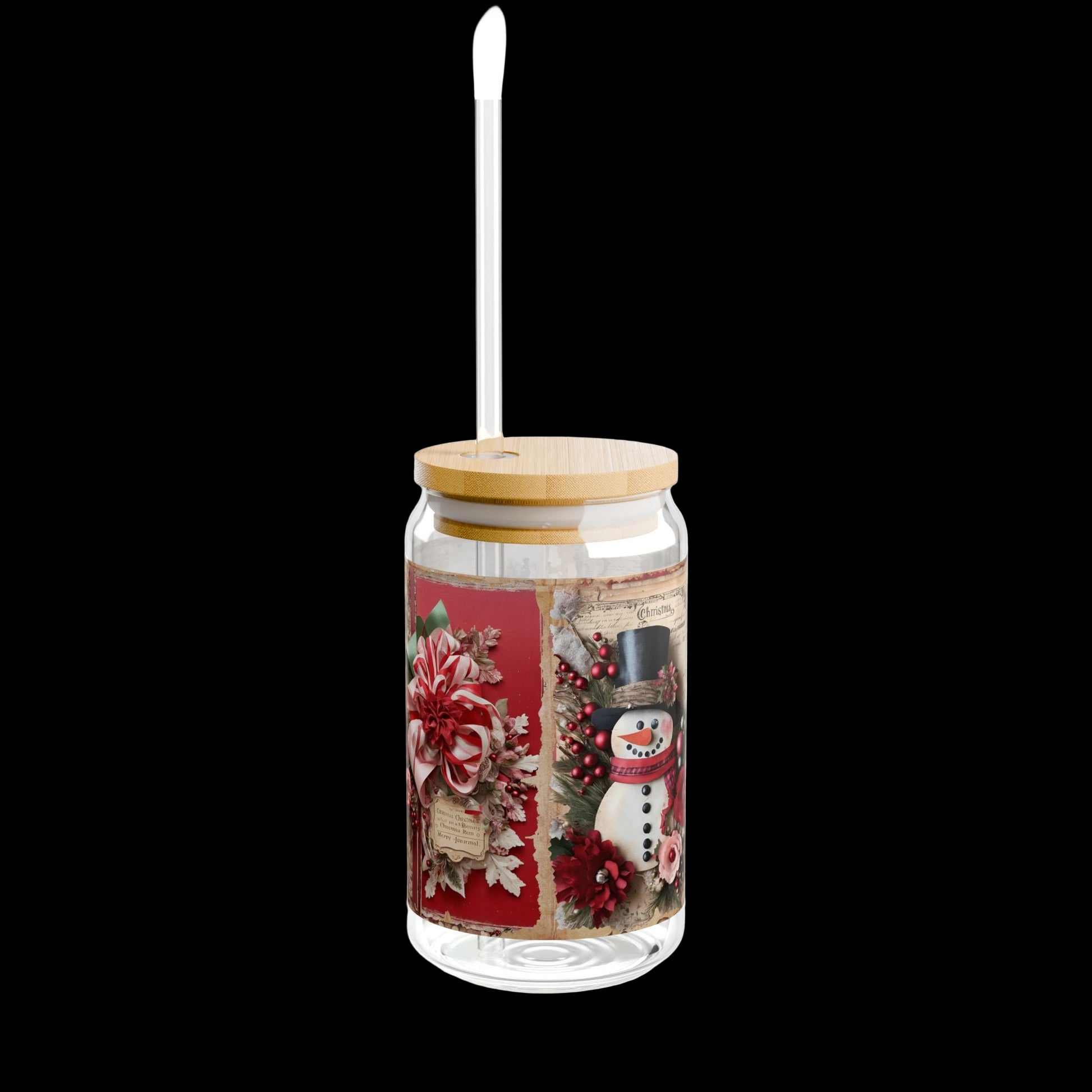 Clear glass tumbler with Christmas design, wooden lid, and straw on a white background